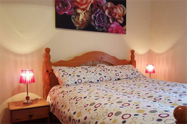 Main bedroom of 2 bed apartment to let in Moville from eZlet